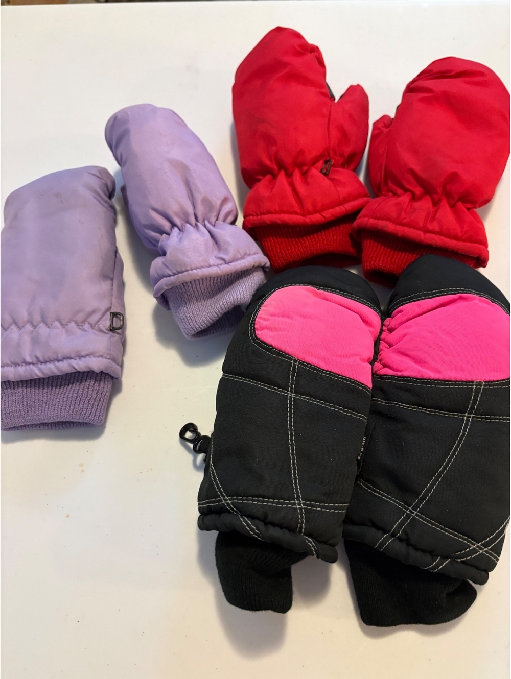 Three pairs of kids mittens